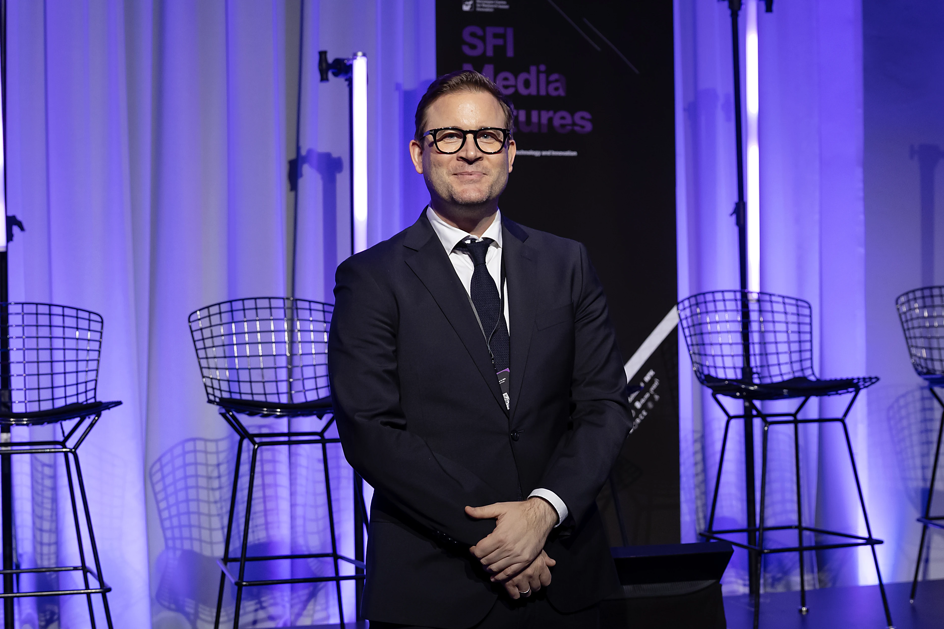 Christoph Trattner at the SFI MediaFutures Annual Meeting, standing in front of the stage.